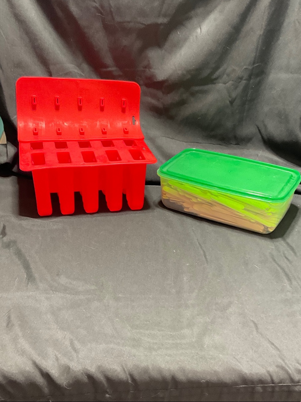 Red Popsicle Mold & Green Storage Box with popsicle sticks.
